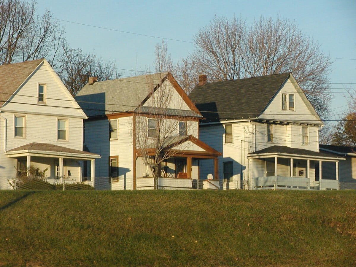 "Three homes in Akron, Ohio as viewed from freeway."
