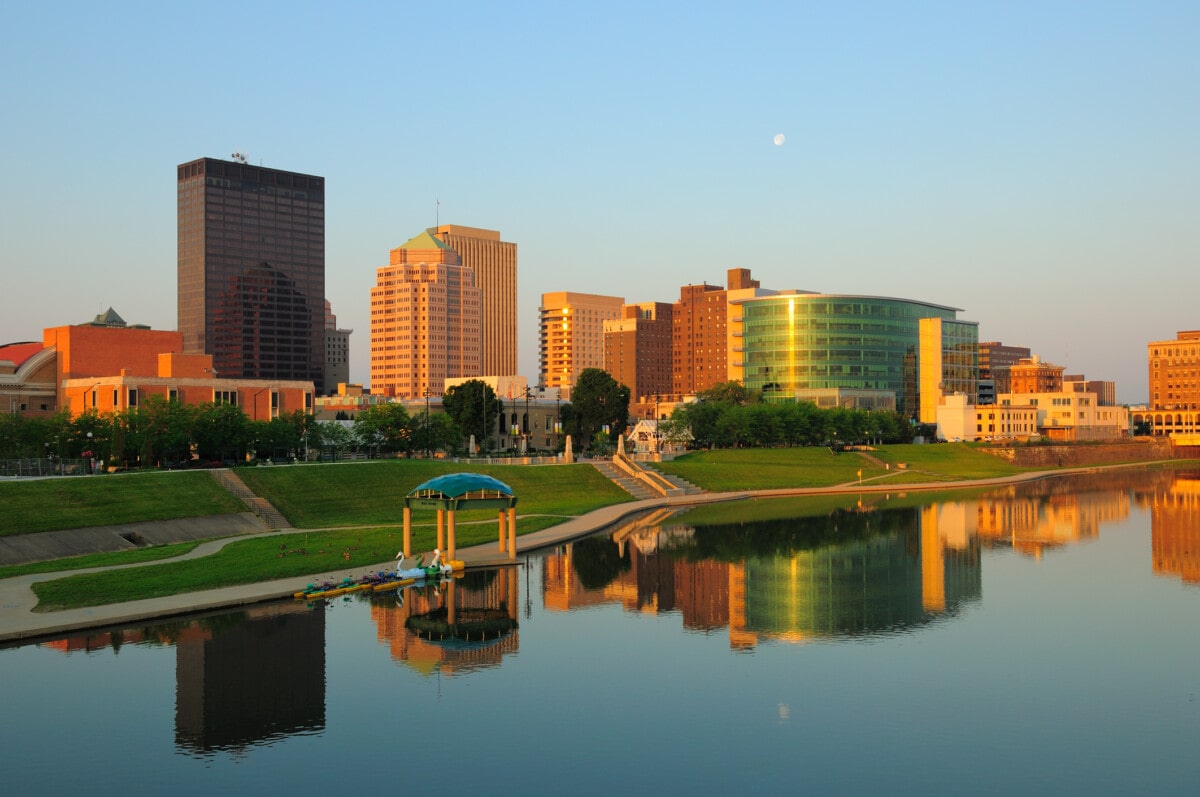"Dayton, Ohio skyline right at sunrise w/ skyline reflections on the River."