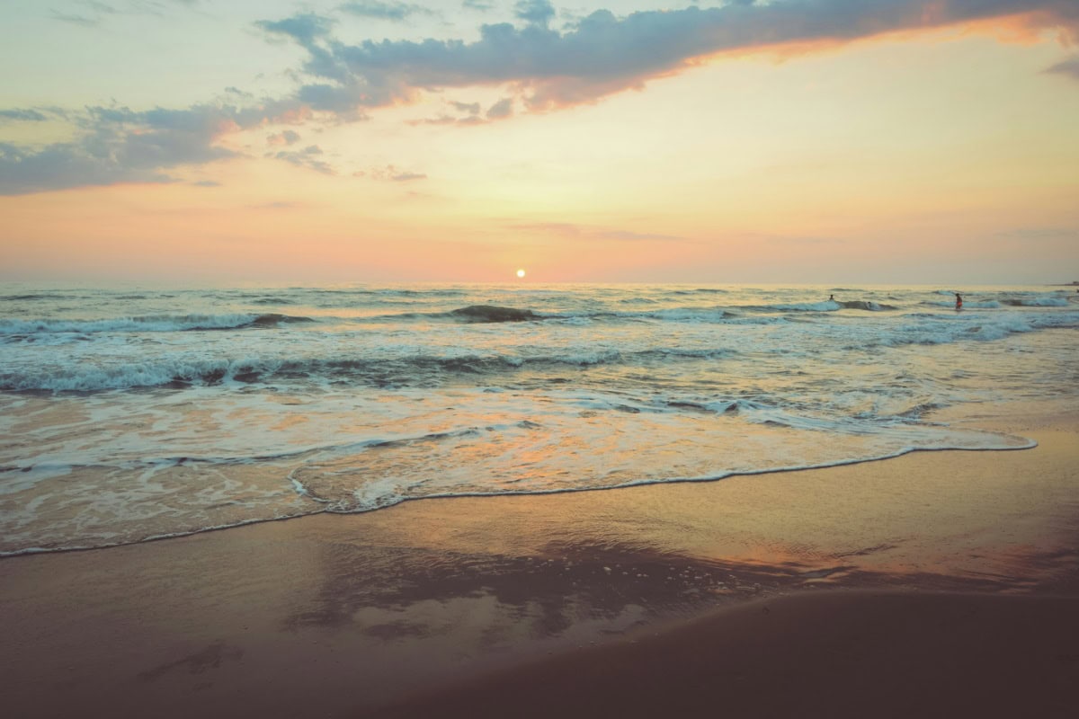 Sunrise at a beach with calming waves