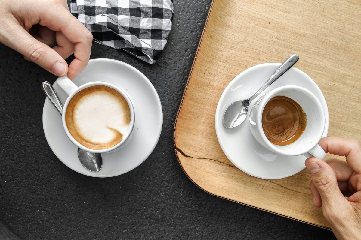 Overhead shot of two Cups of Coffee on a table