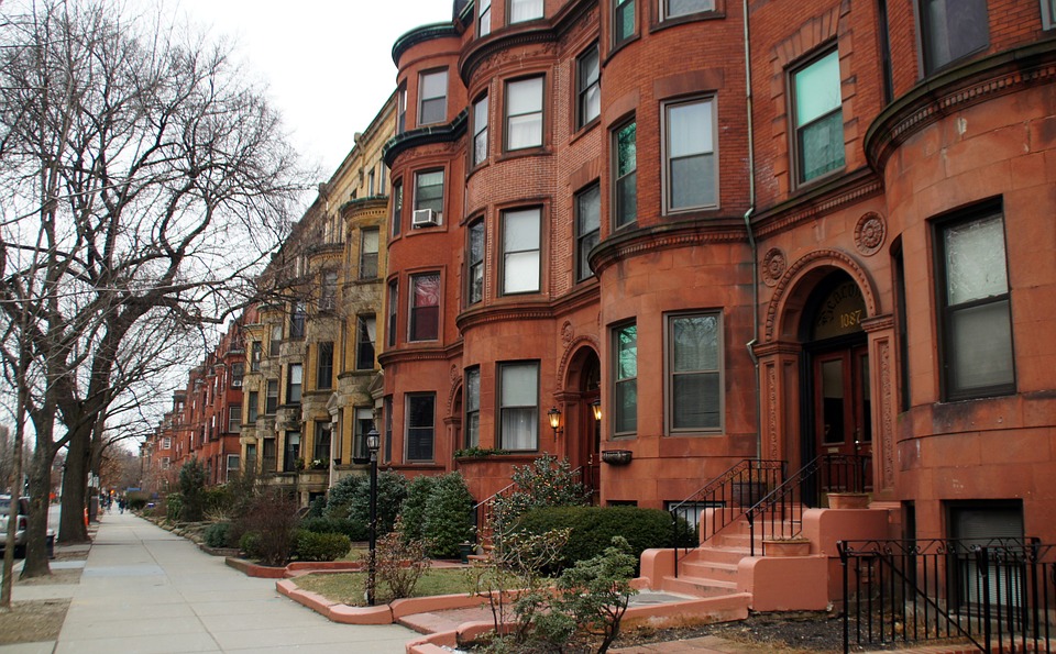 brown renaissance revival row houses on a street