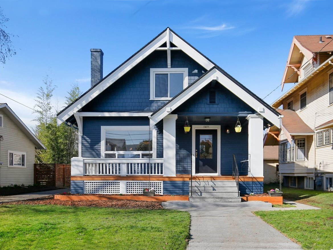 blue house with white trim in affordable portland suburbs