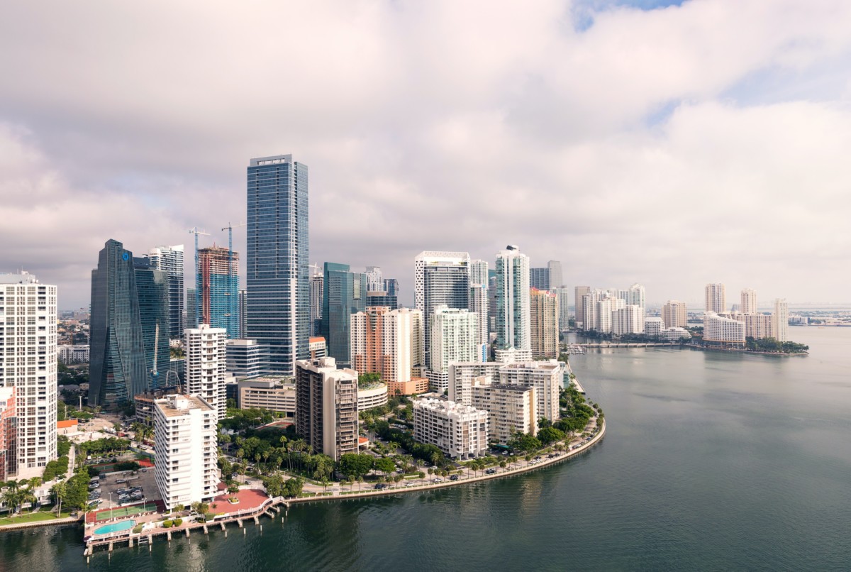 picture of downtown miami buildings with the coast line and cloudy sky