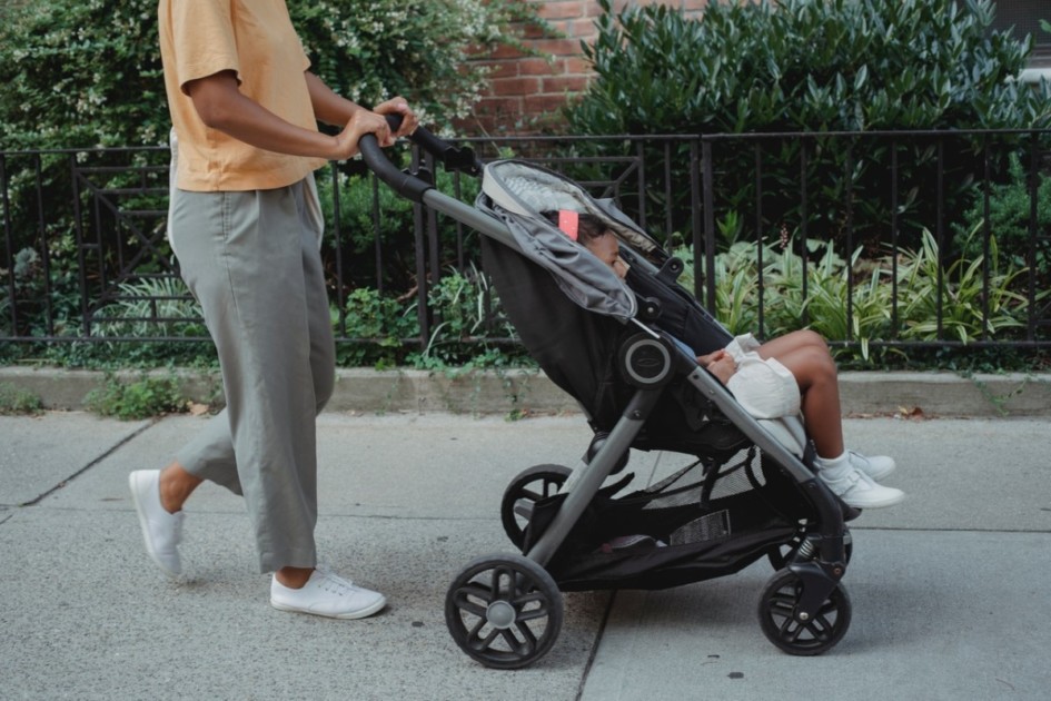 Woman pushing child in a stroller