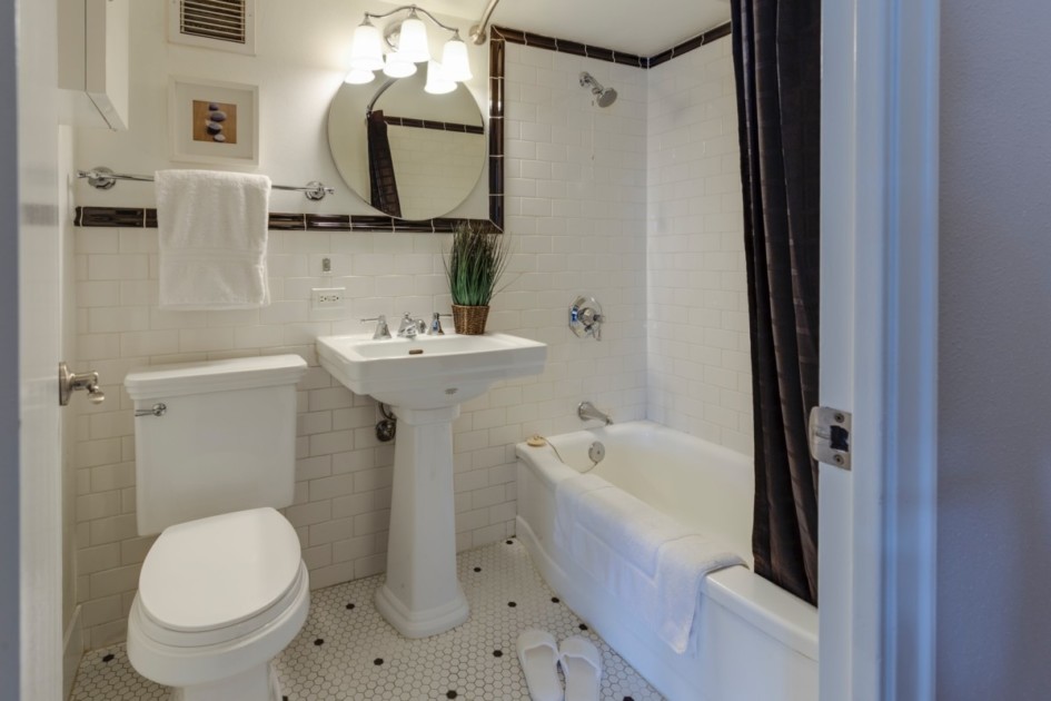 apartment bathroom with white tiles