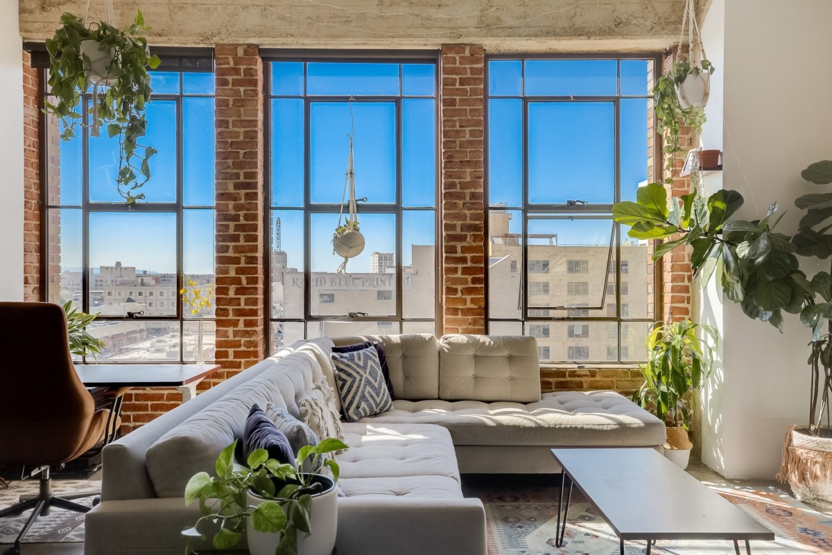 hard loft with exposed brick next to the windows