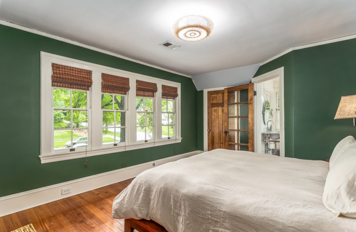 green colored paint with a matte finish in a bedroom