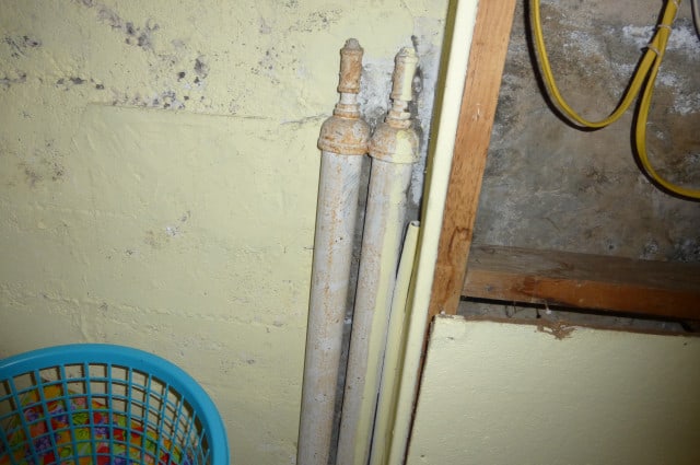 old oil pipes in early 1900s home