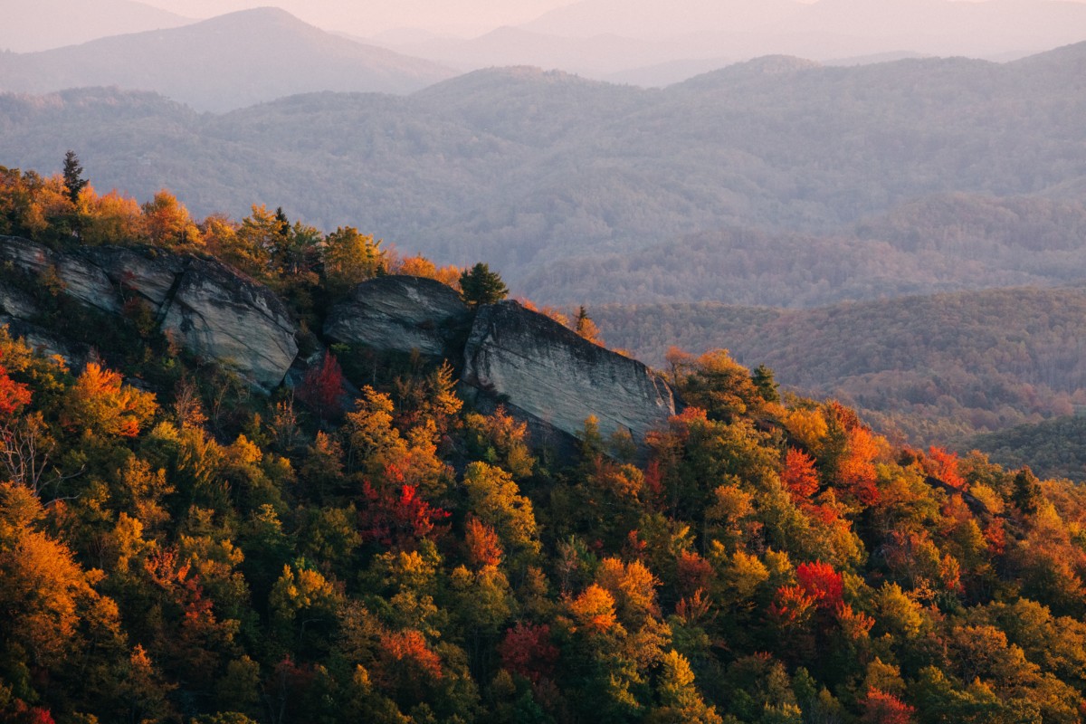 mountain range in north carolina with lots of autumn colored trees