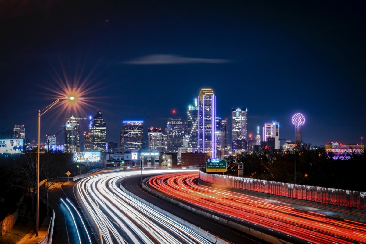 view of dallas texas at night time from the freeway