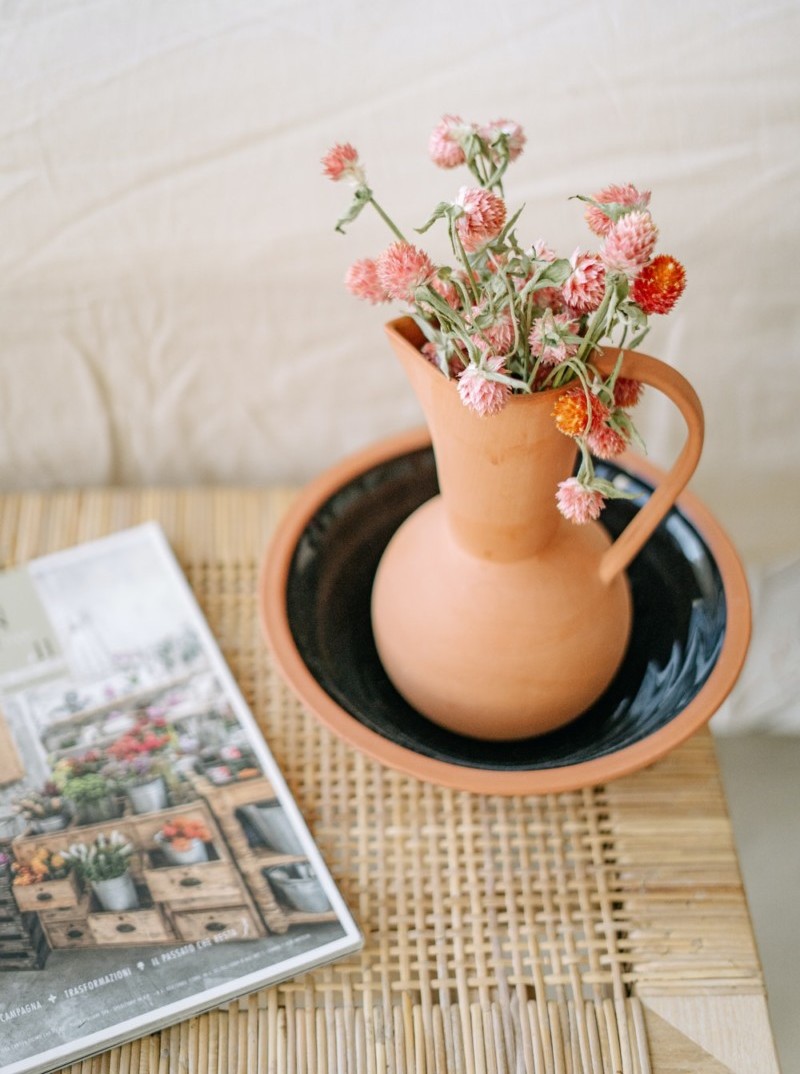 Vase with pink flowers on a coffee table